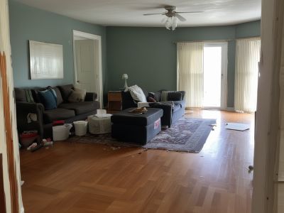 Living room before cleaning - dusty surfaces and clutter