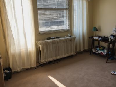 Bedroom before cleaning - unmade bed and dusty surfaces